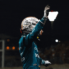 a person wearing a helmet that says the final lap on it