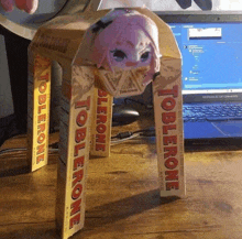 a toblerone box with a stuffed animal inside of it