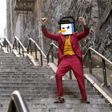 a man in a joker costume is standing on a set of stairs with his arms in the air