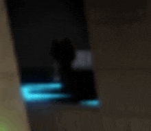 a blurry picture of a person walking in the dark