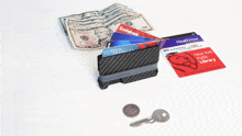 a wallet with a stack of credit cards including skymiles scotiabank and heathrow library