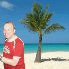 a man wearing a red shirt that says stage