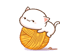 a white cat is playing with a ball of yarn