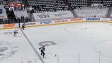 a hockey game is being played on a empty ice rink with a referee .