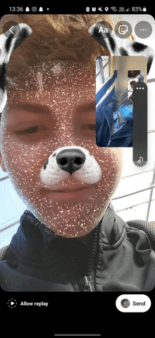 a phone screen shows a man with a dalmatian face mask