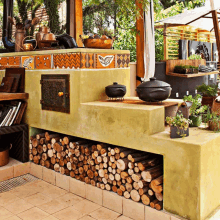 a stack of logs sits under a kitchen counter