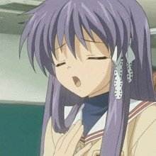 a girl with purple hair is yawning with her eyes closed and her mouth open .