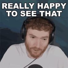 a man wearing headphones with the words " really happy to see that " above him