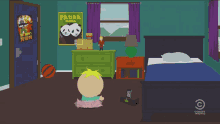 a cartoon character in a room with a panda mania poster on the wall