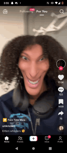 a screenshot of a tik tok app shows a man with a big face