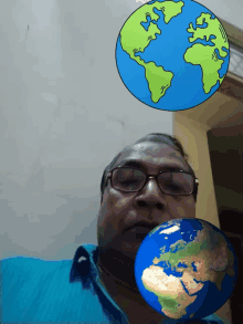 a man with glasses holds a cartoon globe in front of his face