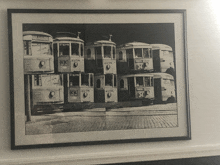 a black and white photo of a row of trolleys with the number 34