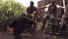 a group of men are sitting around a table with a chimpanzee standing in the middle of the group .