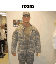 a man in a military uniform is standing in front of a door with the words reans above him .