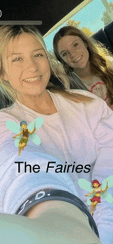 two women are sitting in a car with a sticker that says " the fairies "