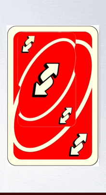 a red playing card with arrows pointing in opposite directions