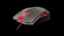 a close up of a computer mouse with red lights