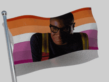 a flag with a picture of a man in glasses on it