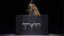 a capybara wearing a top hat and a mustache is holding a box that says tyr