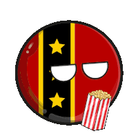 a red and black ball with yellow stars on it and a bag of popcorn next to it