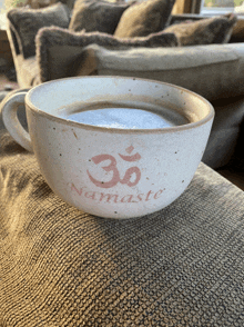 a cup with the word namaste on it