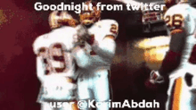 a couple of football players standing next to each other with the words goodnight from twitter