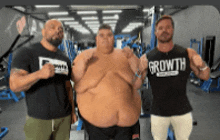 three men are standing next to each other in a gym wearing shirts that say growth