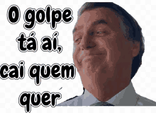 a man in a suit and tie is smiling with the words o golpe ta ai cai quem quer written above him .