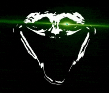 a drawing of a skull with a green light coming out of it 's eyes .