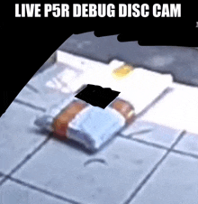 a screenshot of a live p5r debug disc cam showing a bottle on the ground