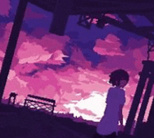 a girl is standing in front of a pink and purple sky .