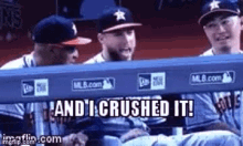 a group of baseball players sitting in a dugout with the words `` and i crushed it '' written on the screen .