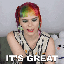 a woman with red and green hair says " it 's great "