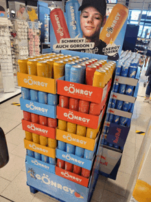 a display of gonrgy energy drinks stacked on top of each other in a store