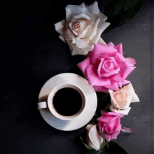 a cup of coffee surrounded by pink and white roses on a saucer