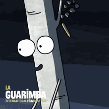 a poster for la guarimba international film festival shows a tree with big eyes