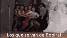 a group of people dancing with the words los que se van de bobiral