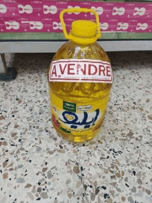 a bottle of oil with a label that says avendre on it