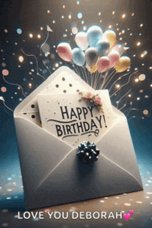 a white envelope with balloons and a card that says happy birthday