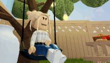 a girl is sitting on a swing under a tree with a smiley face