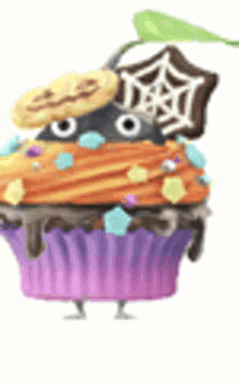 a cupcake with a pumpkin on top and a spider web on it .