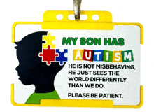 a sign that says " my son has autism " on it