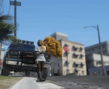 a woman stands next to a black gmc van