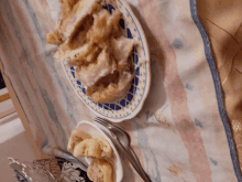 a plate of food with a fork on a table cloth