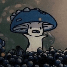 a cartoon mushroom is sitting in a pile of blueberries .