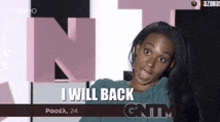 a woman with long hair is standing in front of a sign that says i will back .