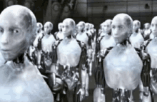 a row of robots are standing in a line with their heads visible