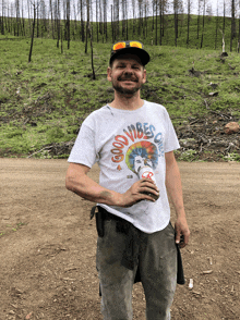 a man wearing a good vibes only shirt