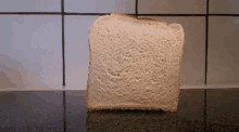 a slice of bread is sitting on a counter