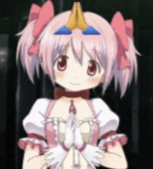 a pink haired anime girl is praying with her hands folded in front of her head .